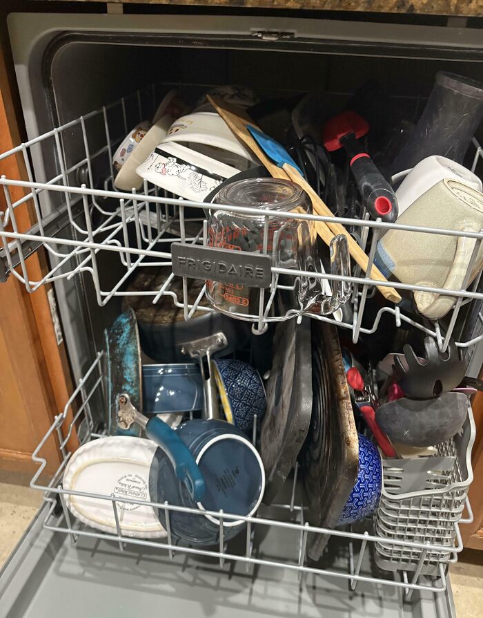Overloaded dishwasher representing habits of annoying boyfriends and husbands.