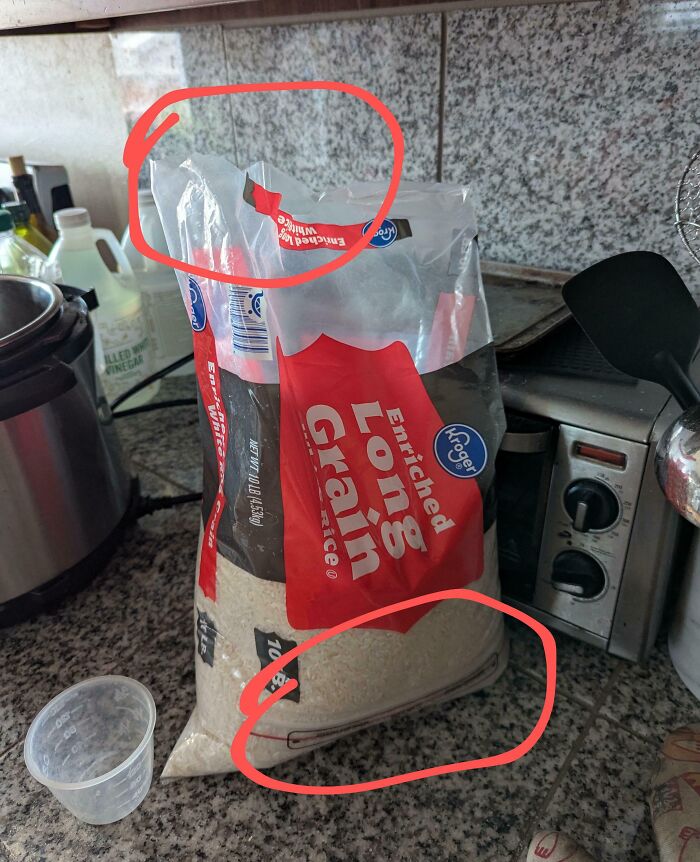 Unsealed rice bag on a kitchen counter, a common trait seen in annoying boyfriends or husbands' habits.