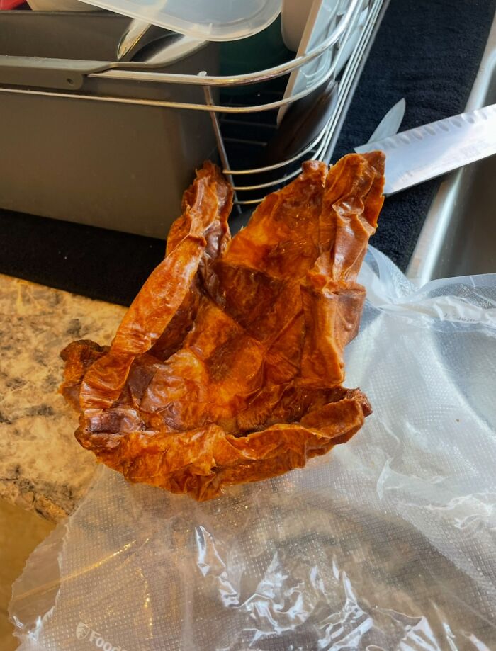 Dried food item resembling crumpled paper, left on a kitchen counter, possibly illustrating annoying boyfriends and husbands.
