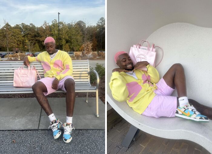 Man in vibrant outfit with pastel colors, including a yellow sweater and pink shorts, posing confidently with a stylish bag.