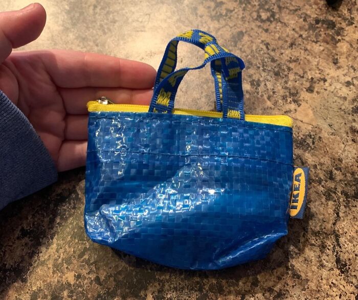 A tiny blue IKEA bag held in hand, a random item that caught attention.