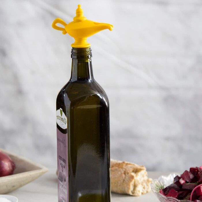 Yellow magic lamp bottle stopper on an olive oil bottle; random things that capture attention.