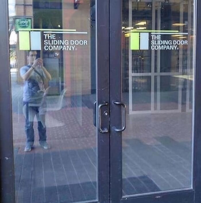 Glass doors with handles at The Sliding Door Company, showing a design fail with doors not sliding.