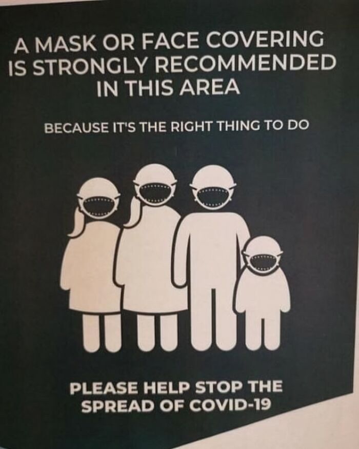 Sign with poorly designed face masks on figures, highlighting design fail in essential health advisory.