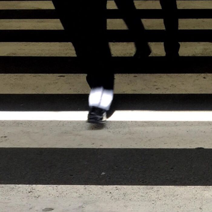 Crosswalk capture by Jose Ruiz González, highlighting ordinary moments with creative perspective.