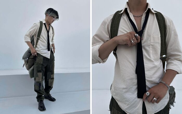 Fashion risk: Person in white shirt, necktie, and patched cargo pants, wearing rings, showcasing unique style.