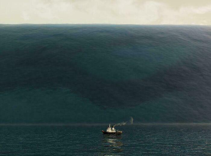 Fishing boat dwarfed by a massive ocean wave, illustrating the concept of megalophobia with scarily big natural forces.