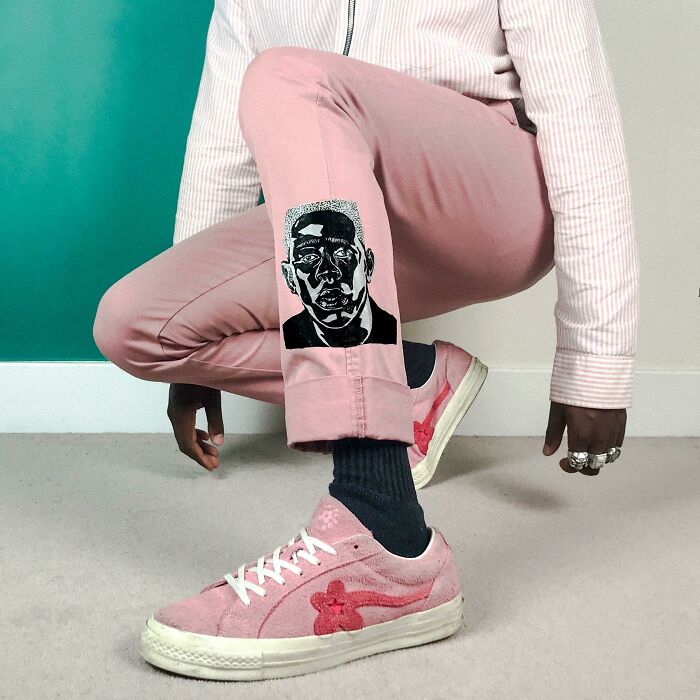 Fashion risk with pink pants featuring bold artwork, matched with stylish pink sneakers.