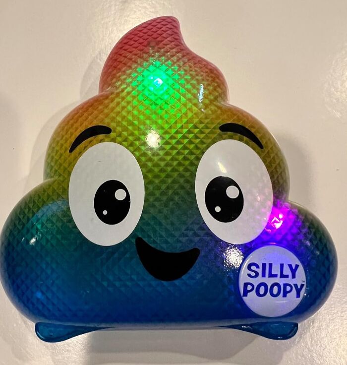Colorful p**p emoji toy with "Silly Poopy" label, perfect gift for the fun aunt or uncle.