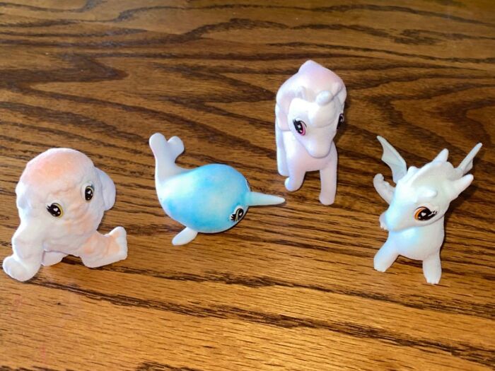 Cute mythical creature toys on a wooden table, perfect for the fun aunt or uncle.