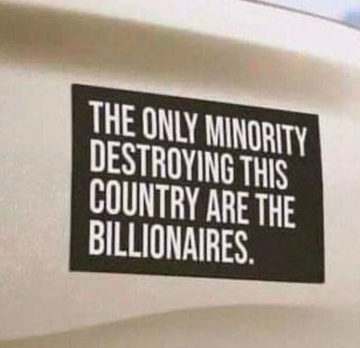 Text on a wall highlighting anti-capitalism sentiment, reads, "The only minority destroying this country are the billionaires."