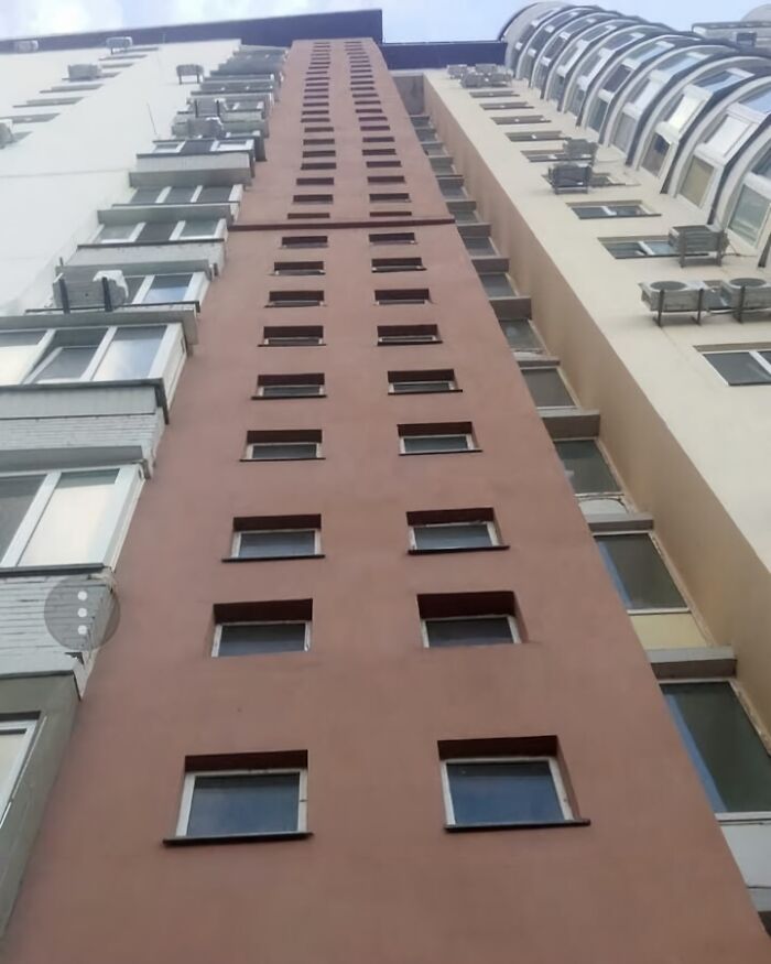 Building with numerous misaligned windows, showcasing an architectural fail.