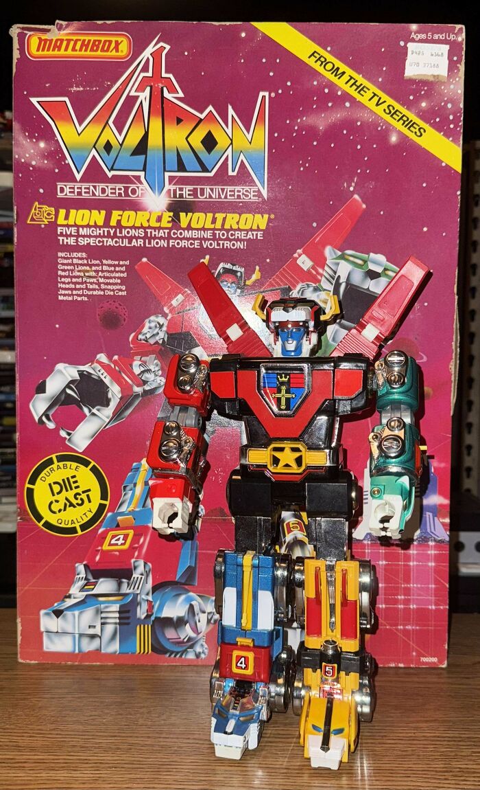 Vintage toy Voltron figure with original packaging, featuring colorful combiner lions from the classic TV series.