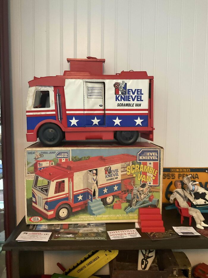 Vintage toy Evel Knievel Scramble Van with box and action figures on display.