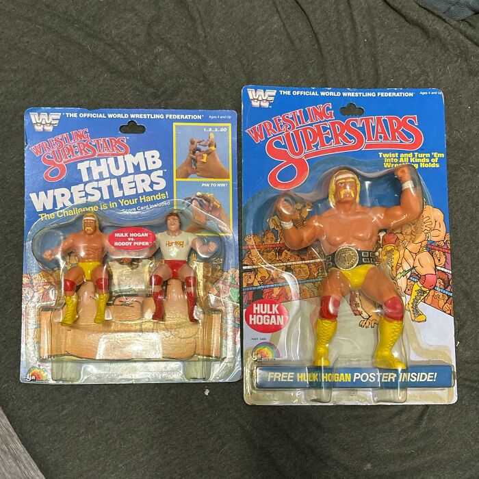 Vintage toys featuring wrestling action figures in original packaging on display.