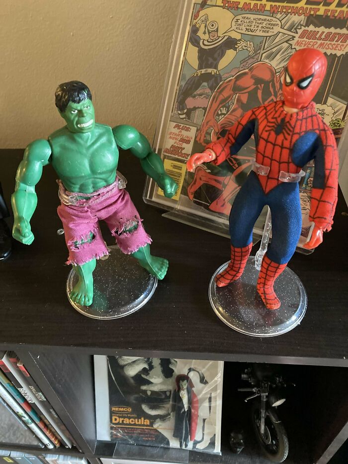 Vintage toys featuring Hulk and Spider-Man figures on display shelf.