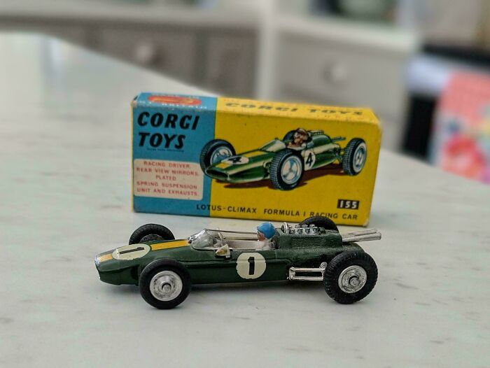 Vintage toy car, Corgi Toys Lotus-Climax Formula 1 with original box, evokes childhood nostalgia.