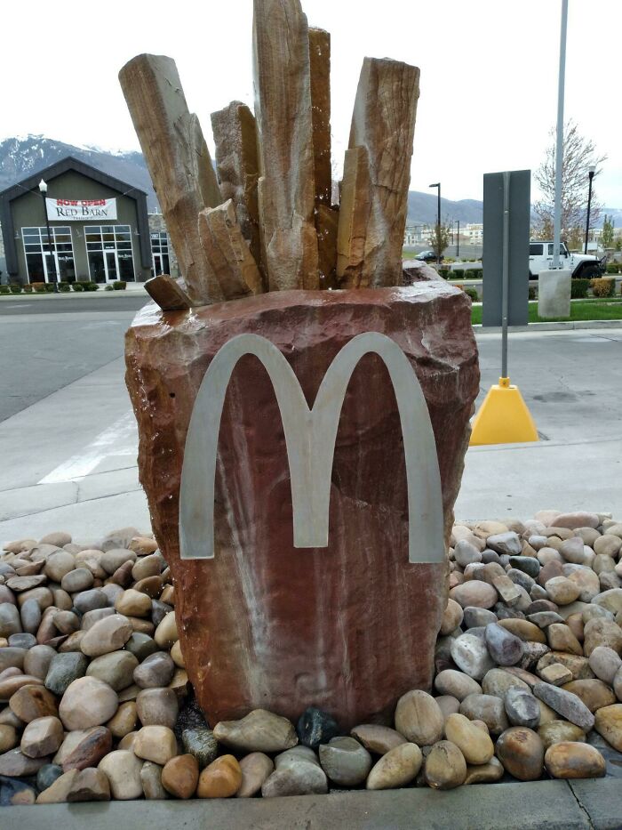 Rock sculpture resembling fries with a McDonald's logo, showcasing tourist-interesting-experiences.