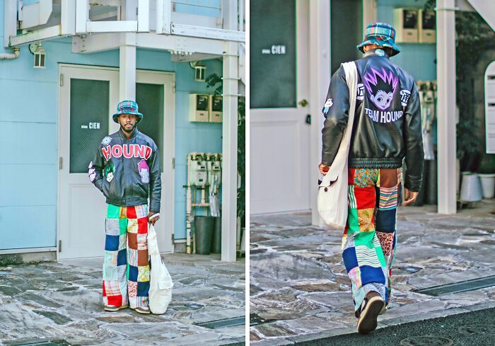 Fashion risks: A person wearing colorful patchwork pants, a graphic jacket, and a bucket hat in a vibrant street style look.