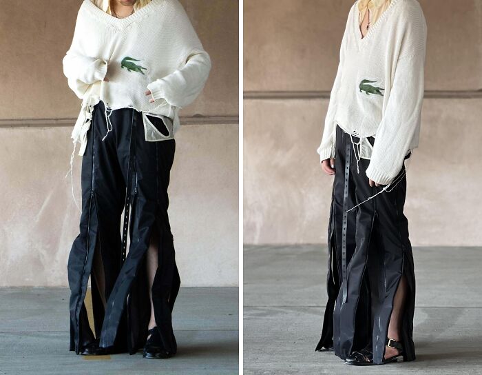 Person wearing a distressed sweater and innovative black slit pants, showcasing a bold fashion risk nailed.