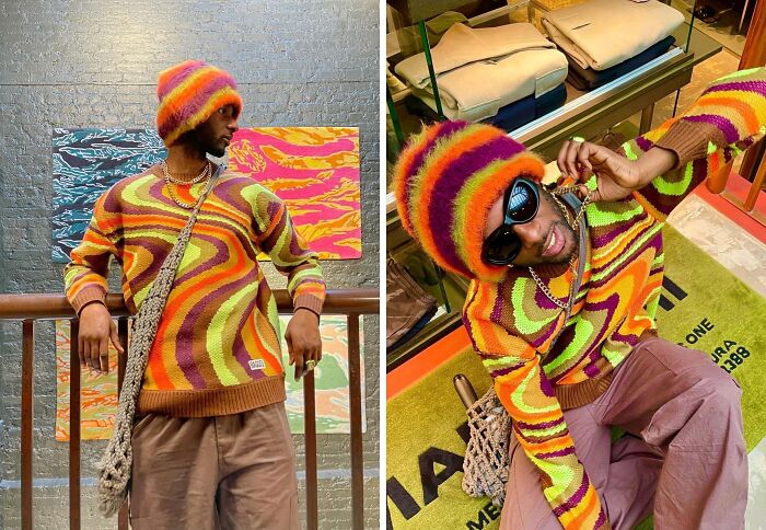 Person in colorful knit sweater and hat, showcasing bold fashion choices with abstract art background and sunglasses.