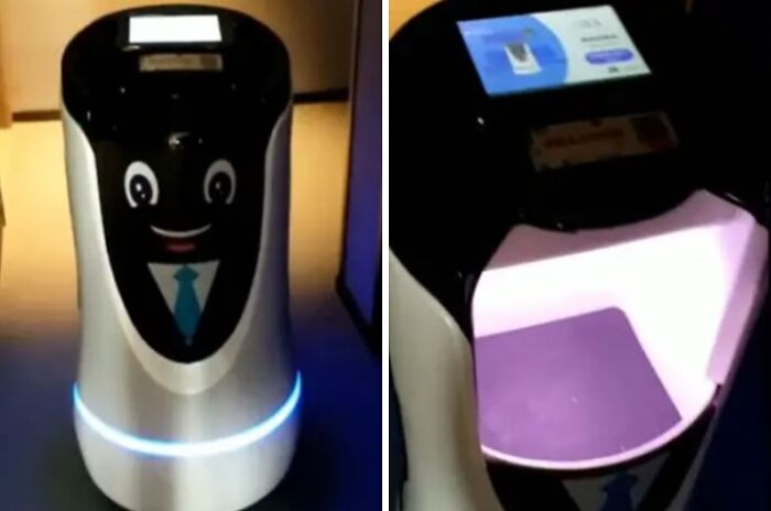Interactive hotel robot with a smiling face, offering tourists interesting experiences in hospitality services.
