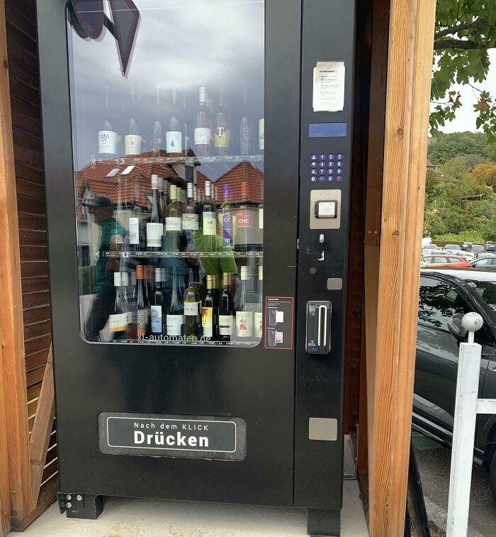 Vending machine filled with wine bottles, a unique tourist experience.