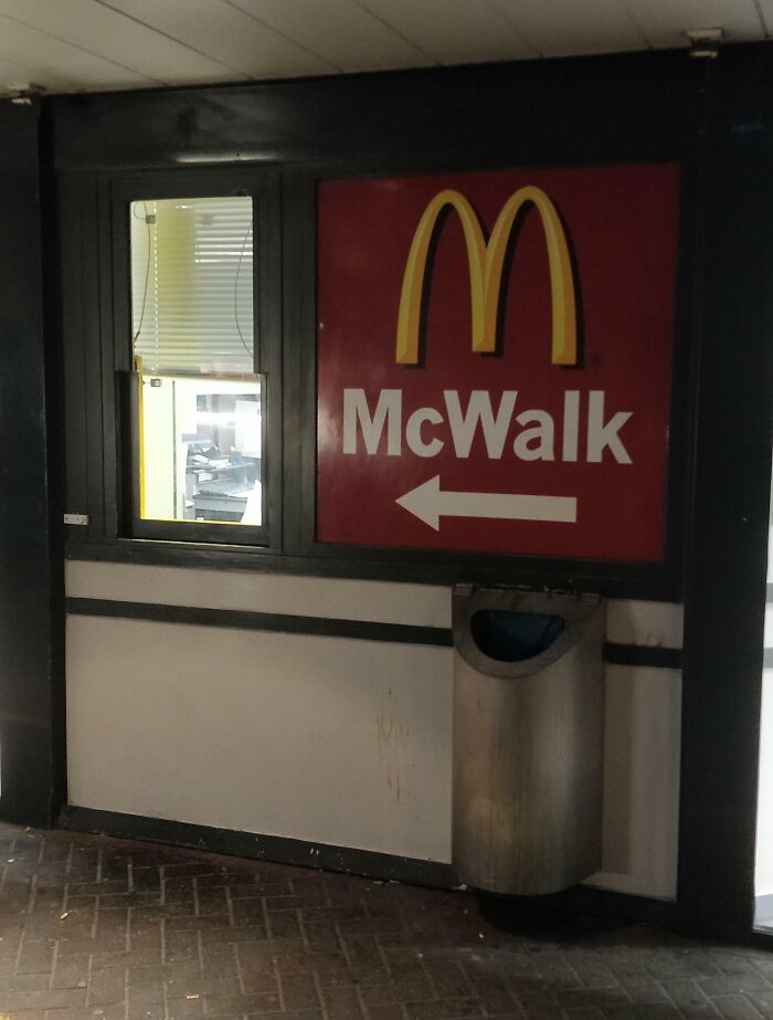 "McWalk sign inside a McDonald's, showcasing tourist interesting experiences with unique fast-food service."