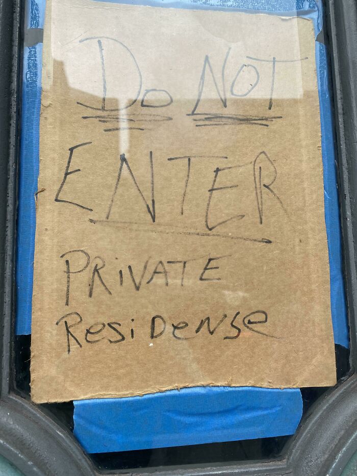 Cardboard sign with incorrect spelling: "Do Not Enter, Private Residense," displaying ridiculous word spellings.