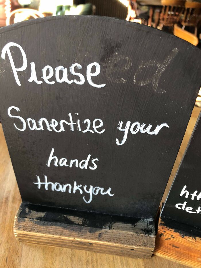 Chalkboard sign with incorrect spelling: "Sanertize your hands," causing grammar police to cringe.