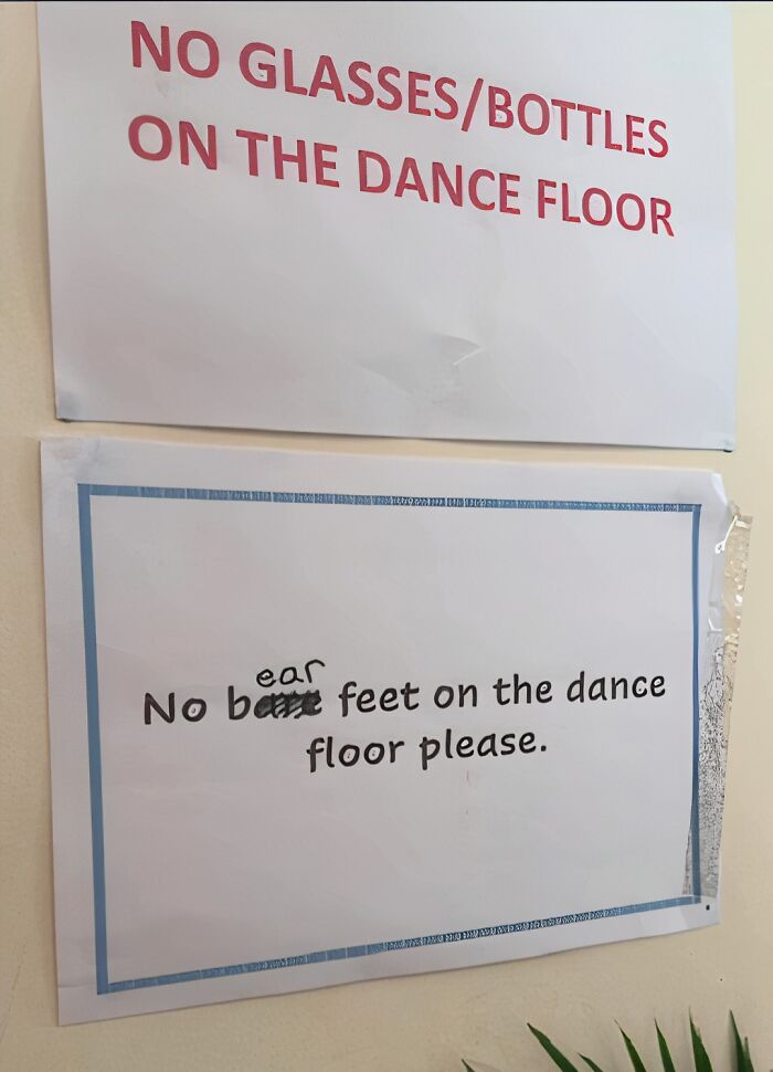 Sign with incorrect correction: "No bare feet" changed to "No ear feet."