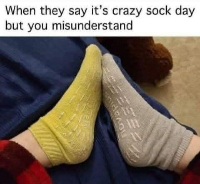 Two mismatched socks on a blue background, capturing mental health meme humor.