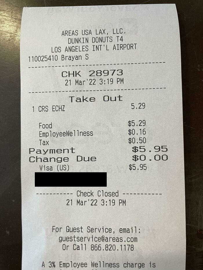 Interesting receipt showing a Dunkin' Donuts airport purchase with an Employee Wellness charge listed.