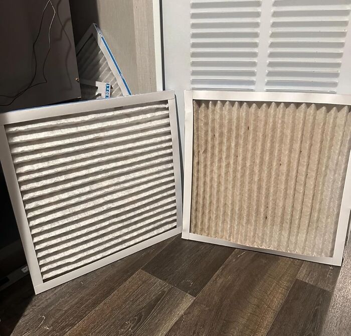 Two air filters, one clean and one dirty, leaning against a wall, ready for a spring cleaning headstart.