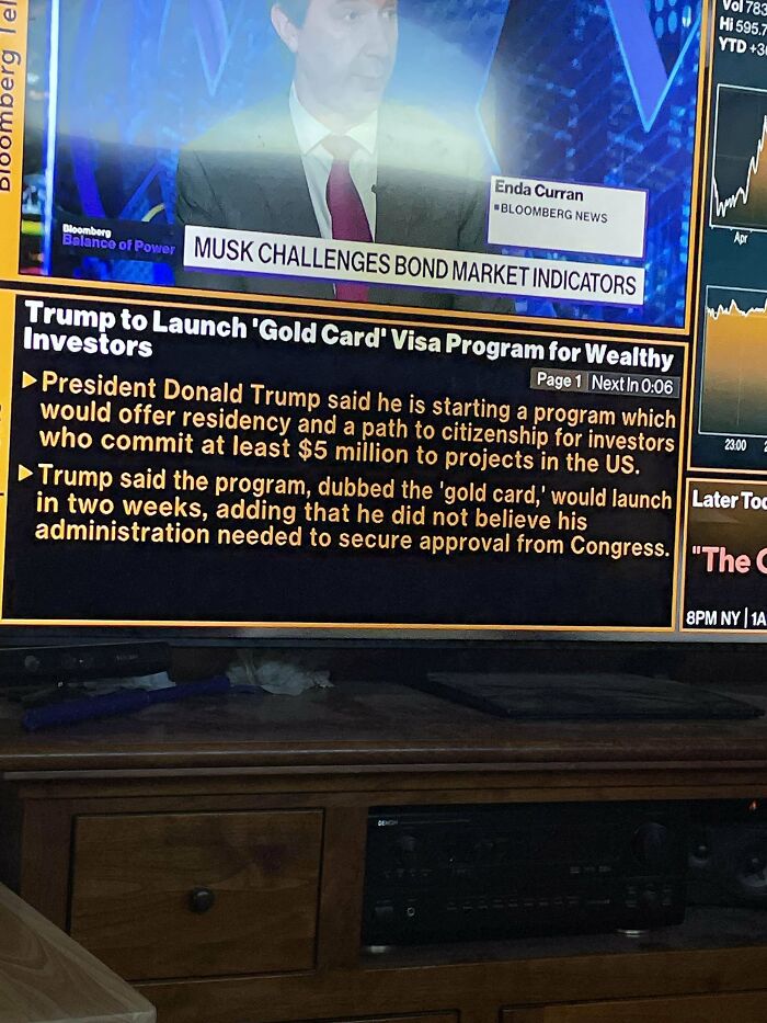 TV screen showing news about Trump's 'Gold Card' visa for wealthy investors.