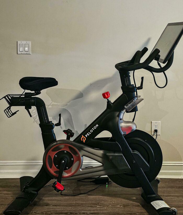 Peloton bike found while thrifting, featuring a sleek design and touchscreen display.