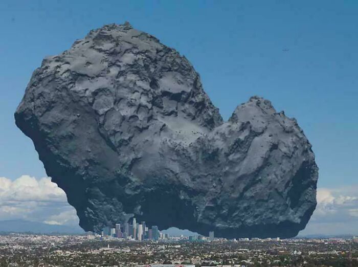 Massive asteroid looming over a city skyline, illustrating an extreme example of megalophobia and fear of large objects.