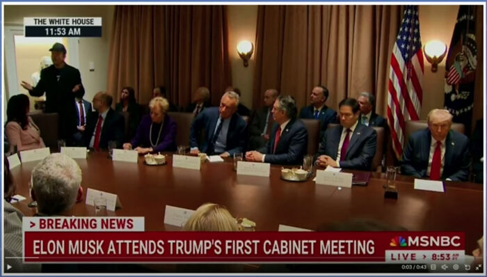 Meeting room with officials, including Elon Musk, attending Trump's cabinet meeting at the White House.