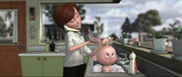 Animated scene of a woman talking on the phone while washing a baby in a kitchen sink, highlighting questionable movie details.