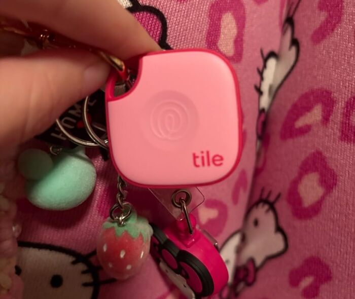Pink Tile tracker on a keychain with cute charms, a problem-solving product to simplify your daily life.