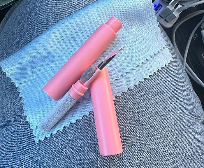 Pink precision craft tool on blue fabric, designed to simplify daily problem-solving tasks.