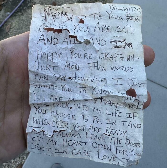 A weathered, handwritten note being held, with heartfelt message as an interesting receipt found.