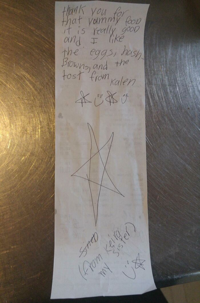 A child's handwritten note on a receipt praising food, with doodles and stars, as an interesting receipt people found.