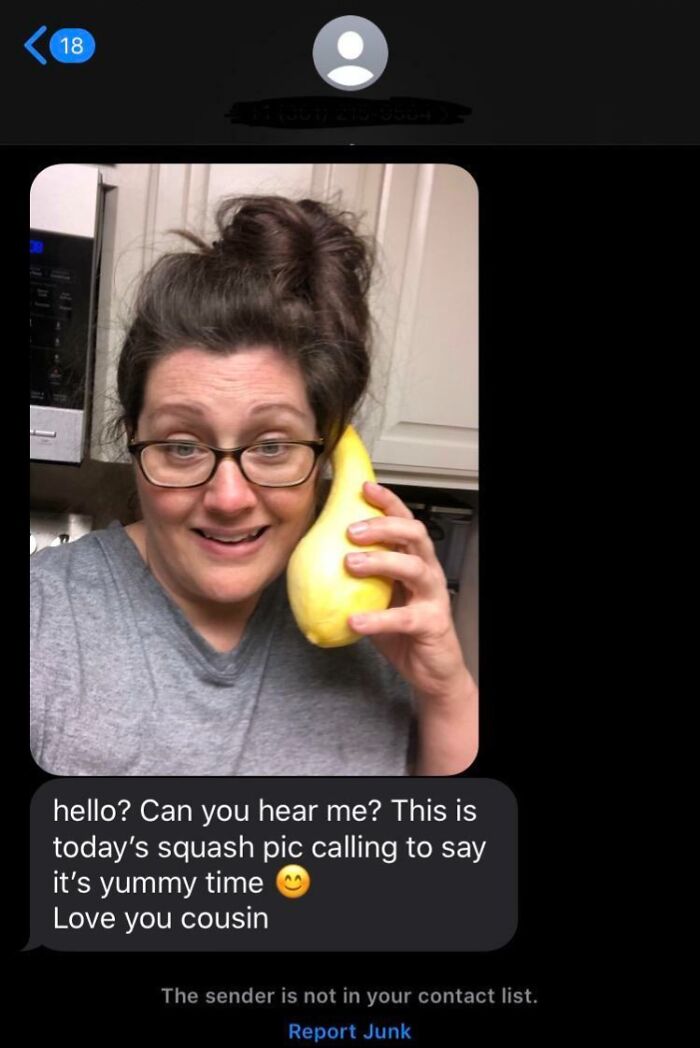 Woman holding squash like a phone, jokingly sending funny messages to the wrong recipient.