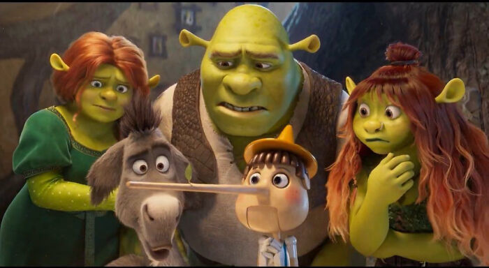Shrek characters reacting to questionable movie details in an animated film scene mocked by cinephiles online.