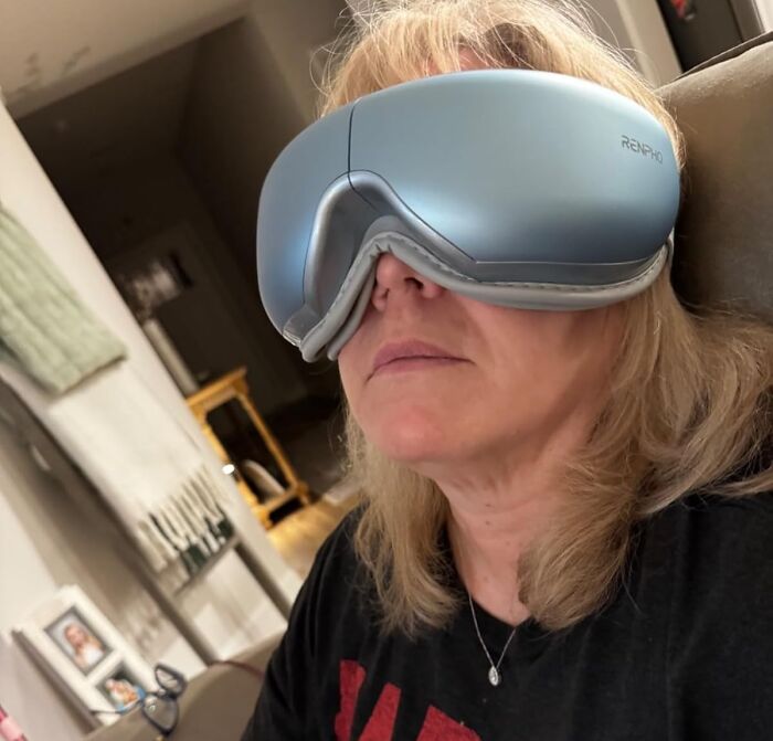 Person using futuristic eye mask, demonstrating impulse buys worth it from Reddit.