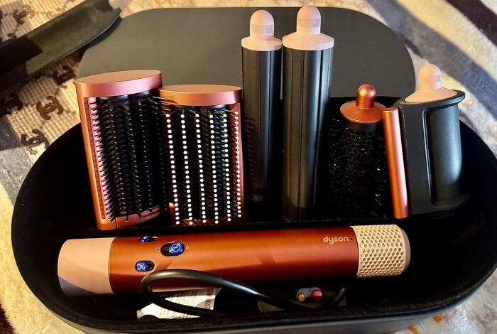 Dyson hair styling set displayed in a case, an example of impulse buys worth it.