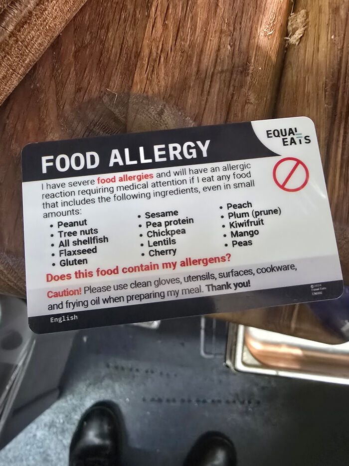 Food service industry allergy card listing common food allergens like peanuts and tree nuts, with a caution for food prep.