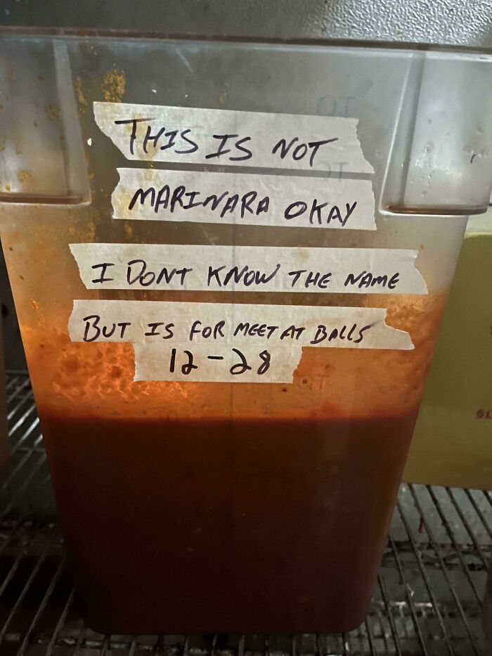 Container labeled "This is not marinara," showcasing humor in food service industry.
