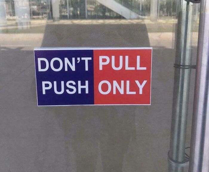 Confusing sign saying "DON'T PULL PUSH ONLY" on a glass door, showcasing sign fails.